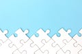 White puzzle frame on pastel blue background