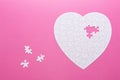 White puzzle heart on pink background. Top view Royalty Free Stock Photo