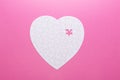 White puzzle heart on pink background. Top view Royalty Free Stock Photo