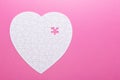 White puzzle heart on pink background. Top view Royalty Free Stock Photo