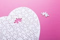 White puzzle heart on pink background. Top view Royalty Free Stock Photo