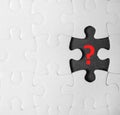 White puzzle with missing piece and question mark on black background Royalty Free Stock Photo