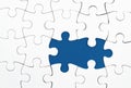 White puzzle over blue backround with missing pieces. Incomplete elements, solution search concept Royalty Free Stock Photo