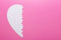 White puzzle part of heart on pink background. Top view Royalty Free Stock Photo