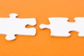 White puzzle parts on orange background Royalty Free Stock Photo