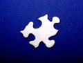 White Puzzle Piece on Blue Royalty Free Stock Photo