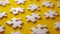 White puzzle pieces scattered systematically on a vibrant yellow background creating an abstract and creative pattern for concept Royalty Free Stock Photo