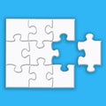 White puzzle with shadows on a blue background Royalty Free Stock Photo