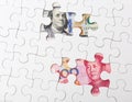 White puzzle with US and chinese banknote