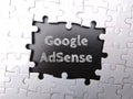 White puzzle with the word Google Adsense Royalty Free Stock Photo