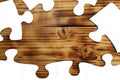 White puzzles lie on a wooden background