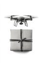 White quadcopter drone carrying wrapped gift box symbolizing futuristic e commerce automated package delivery high tech
