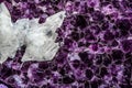 White Quartz Crystals on a Background of Amethysts Royalty Free Stock Photo