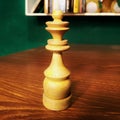 White Queen Chess Piece on a Wooden Table Royalty Free Stock Photo