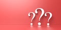 White question marks on red background with empty space on left side Royalty Free Stock Photo