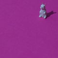 White rabbit in right up corner on a pink background with copy space. A minimalist Chinese New Year composition