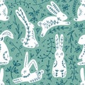 White rabbits on blue floral background. Cute bunny seamless vector pattern for kids designs. Perfect for textile