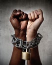 White race hand chain locked together with black ethnicity woman multiracial understanding