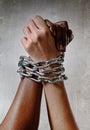 White race hand chain locked together with black ethnicity woman multiracial understanding