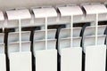 White radiator. Close up elements modern battery - source of heat