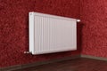 White radiator in red room Royalty Free Stock Photo