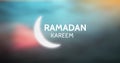 White Ramadan graphic against blue pink blurry background Royalty Free Stock Photo