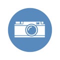 White rangefinder camera icon placed on blue