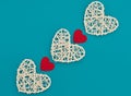 White rattan hearts with red hearts on blue background. Valentine`s Day concept. Valentine greeting card. Flat lay style with cop Royalty Free Stock Photo