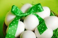 White Raw Eggs With Jolly Green Ribbons And Spring Green Background