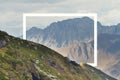 White rectangle in the middle of cloudy mountain landscape. Natural and unkown. Royalty Free Stock Photo