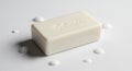 A white rectangular bar of soap embossed with text, \