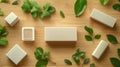 White Rectangular Blocks and Green Leaves on Wooden Background Royalty Free Stock Photo