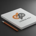 A white rectangular board displays a logo with two stylized key shapes, one orange an Royalty Free Stock Photo