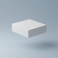 A white, rectangular box appears to be floating against a plain, light blue background. Royalty Free Stock Photo