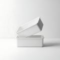 A white rectangular box with a lid placed on a plain background Royalty Free Stock Photo