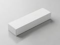A white rectangular box on a plain gray surface with subtle shadow Royalty Free Stock Photo