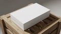 A white rectangular box with a smooth surface is placed on a wooden crate Royalty Free Stock Photo