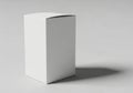A white rectangular box standing upright on a flat surface with a shadow Royalty Free Stock Photo