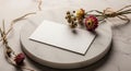 A white rectangular card lies on a circular marble slab with a smooth surface. Royalty Free Stock Photo