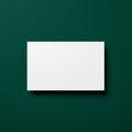 A white rectangular card is positioned on a textured dark green background. The card Royalty Free Stock Photo