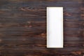 White rectangular empty open box, top view on dark wooden background. top view Royalty Free Stock Photo