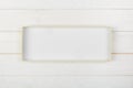 White rectangular empty open box, top view on white wooden background. top view Royalty Free Stock Photo