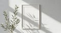 White picture frame on textured wall with green plant and leaf shadows mockup blank Royalty Free Stock Photo