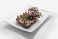 White rectangular plate with baked pork ribs Royalty Free Stock Photo