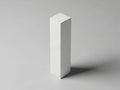 A white rectangular prism standing upright on a gray background with a subtle shadow Royalty Free Stock Photo