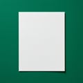 White rectangular sheet centered on a solid green background. The sheet appears bla Royalty Free Stock Photo