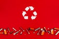 White recycling sign isolated on red background