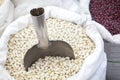 White and red beans in rolled up sacks Royalty Free Stock Photo