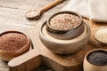 White, red, black and mixed quinoa on wooden table