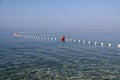 White and red buoyage on the clear sea surface Royalty Free Stock Photo